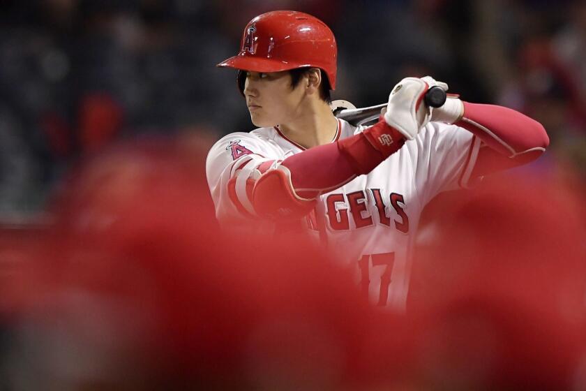 Los Angeles Angels' Shohei Ohtani, of Japan, warms up in the on-deck circle during the first inning of a baseball game against the Oakland Athletics, Friday, Sept. 28, 2018, in Anaheim, Calif. (AP Photo/Mark J. Terrill)
