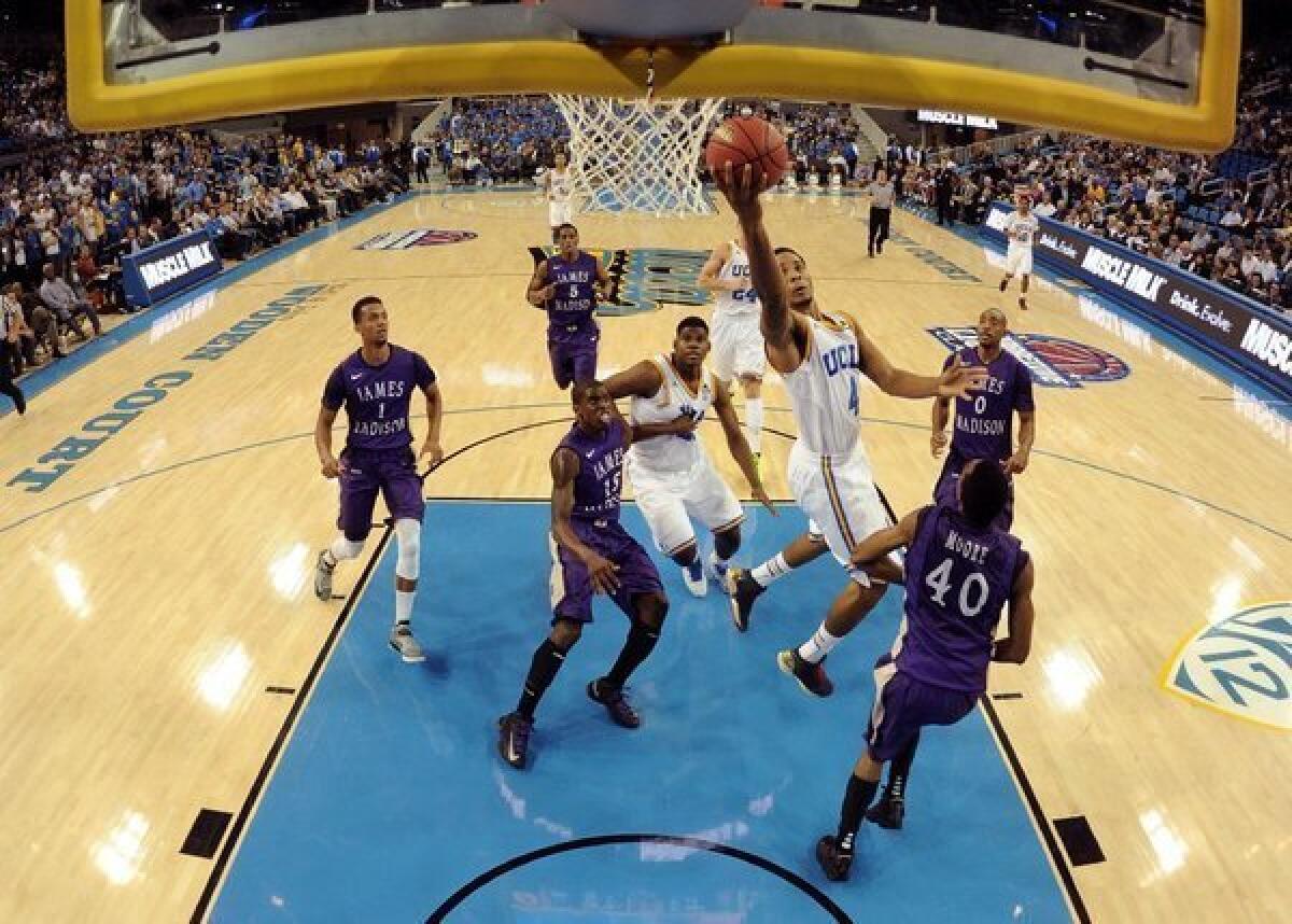 Norman Powell of UCLA scores on a layup during a 100-70 victory over James Madison on Nov. 15.