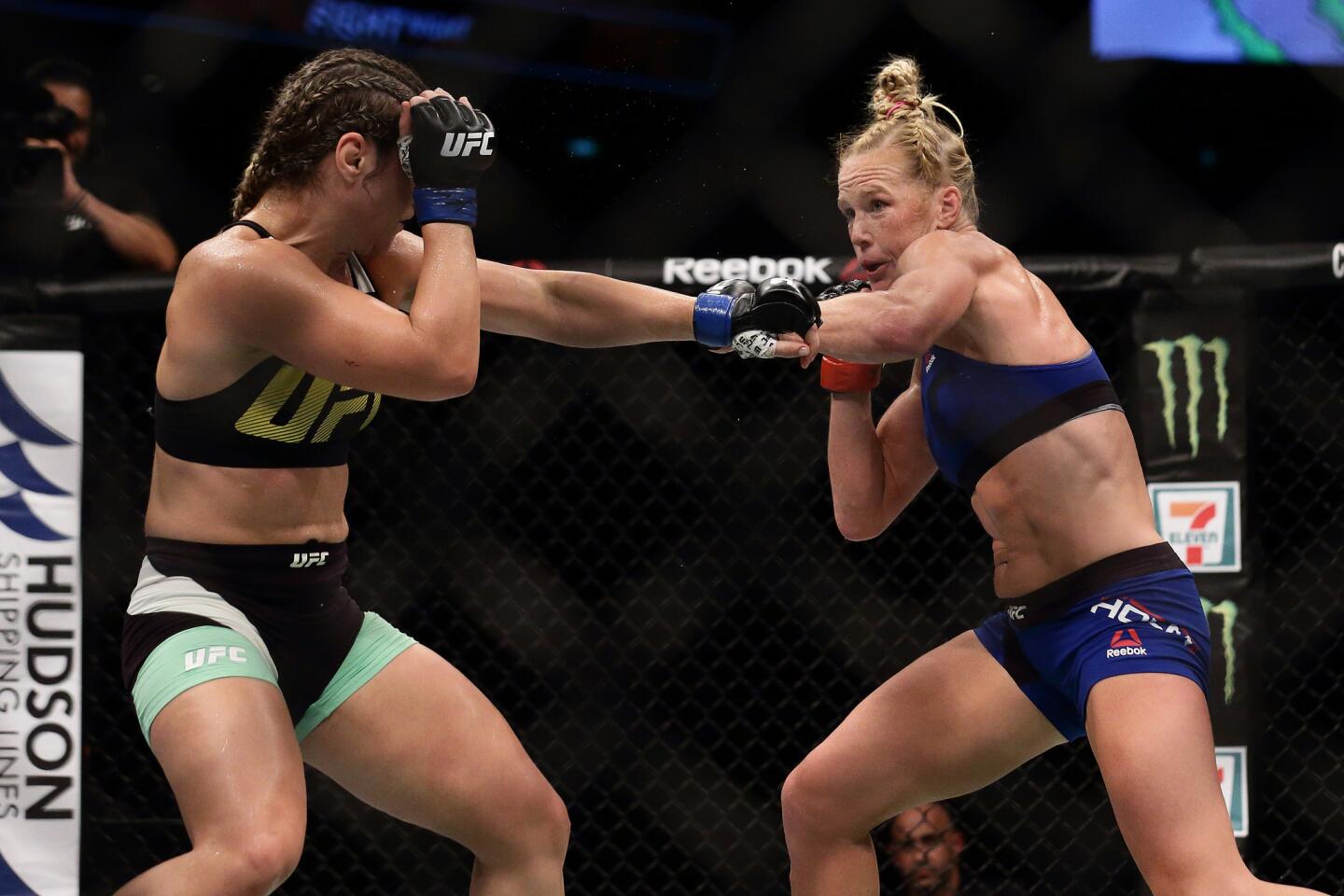 SINGAPORE - JUNE 17: Holly Holm of United States (R) fights Bethe Correia of Brazil (L) in the Women's Bantamweight Main Event Bout during UFC Singapore Fight Night at Singapore Indoor Stadium on June 17, 2017 in Singapore. (Photo by Suhaimi Abdullah/Getty Images) ** OUTS - ELSENT, FPG, CM - OUTS * NM, PH, VA if sourced by CT, LA or MoD **