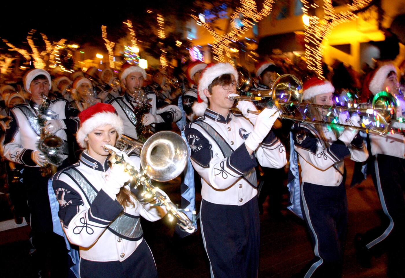 The Crescenta Valley High School band performs for the large crowds gathered on Honolulu Ave. for the annual Montrose-Glendale Christmas Parade in Montrose on Saturday, December 5, 2015. Santa Claus flew above the crowds with the help of the Glendale police dept. helicopter.