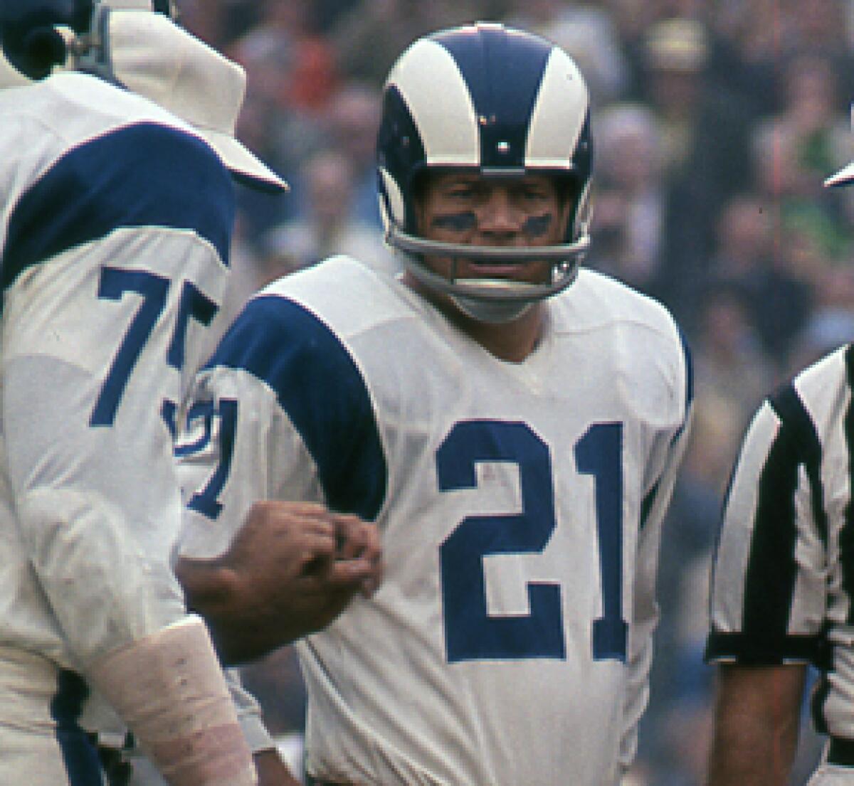 Rams safety Eddie Meador stands on the field during a game in the 1960s.