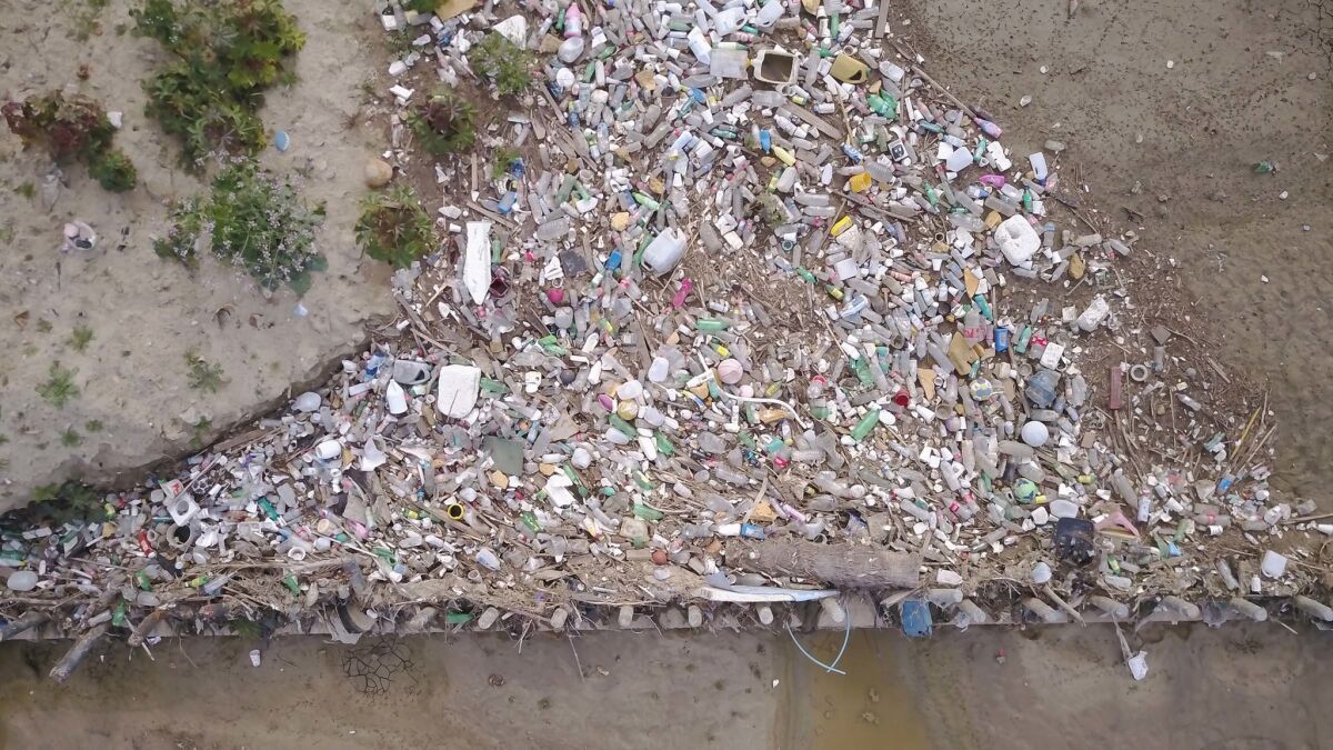 Debris from Mexico in to the US along the border between Tijuana and San Diego. The big aggregation of plastics has been caught in a catchment basin
