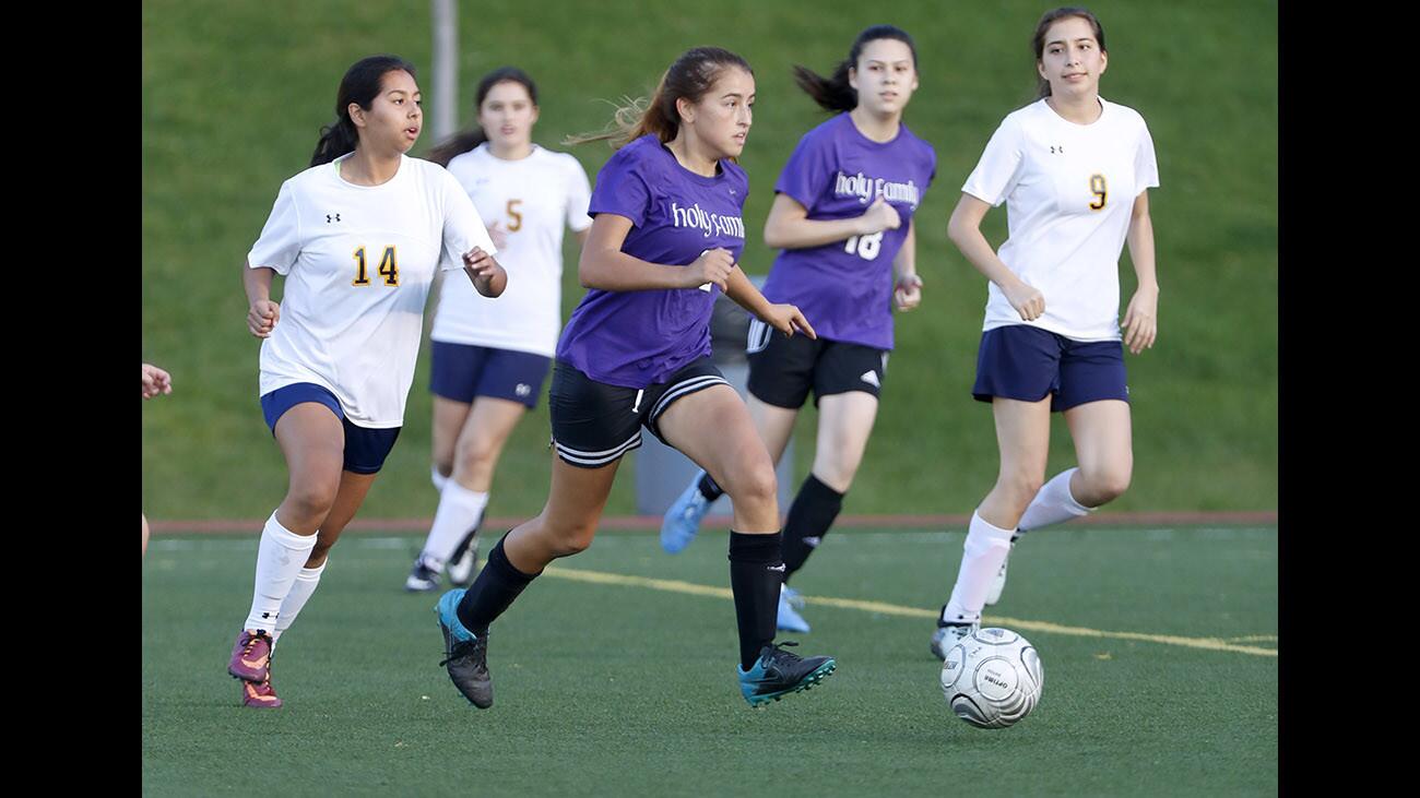 Holy Family High School girls soccer player #32 Brianna Cindrich controls the ball in away game vs. St. Monica High School, at the Glendale Sports Complex in Glendale on Wednesday, Nov. 29, 2017.