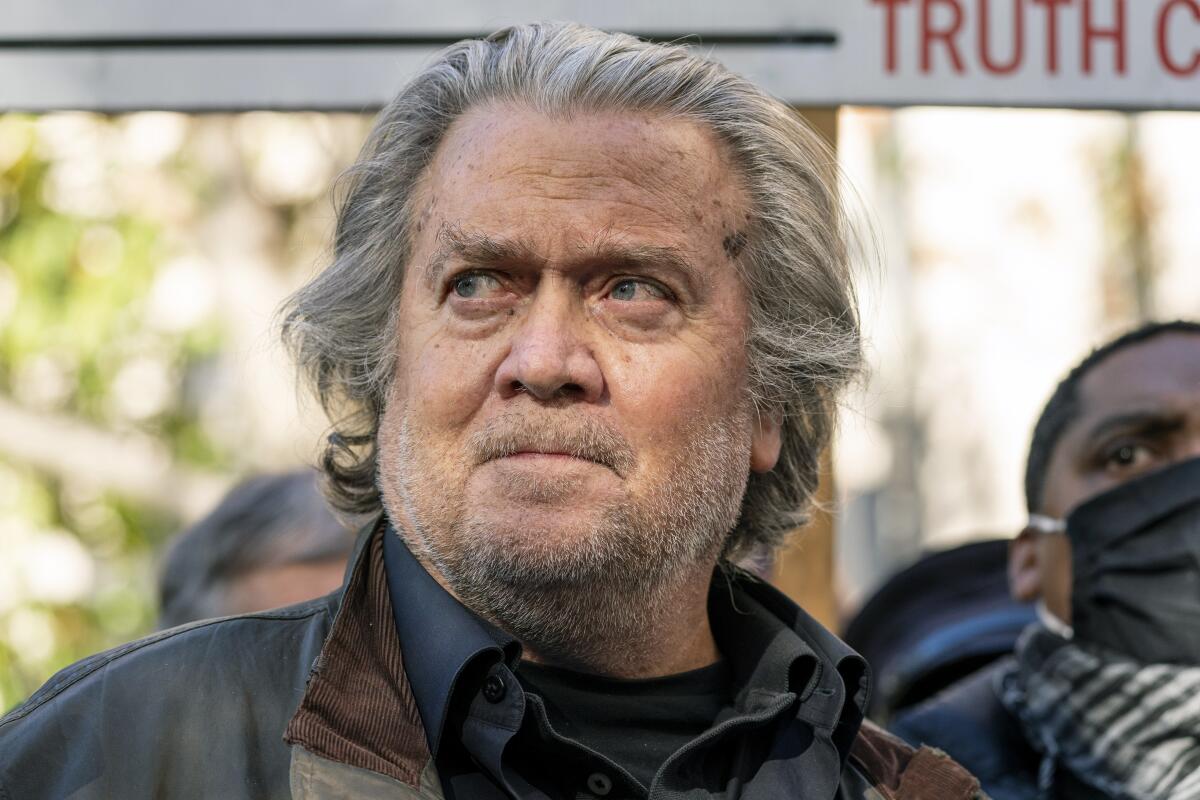 Former White House strategist Steve Bannon speaks with reporters after departing federal court last November in Washington. 