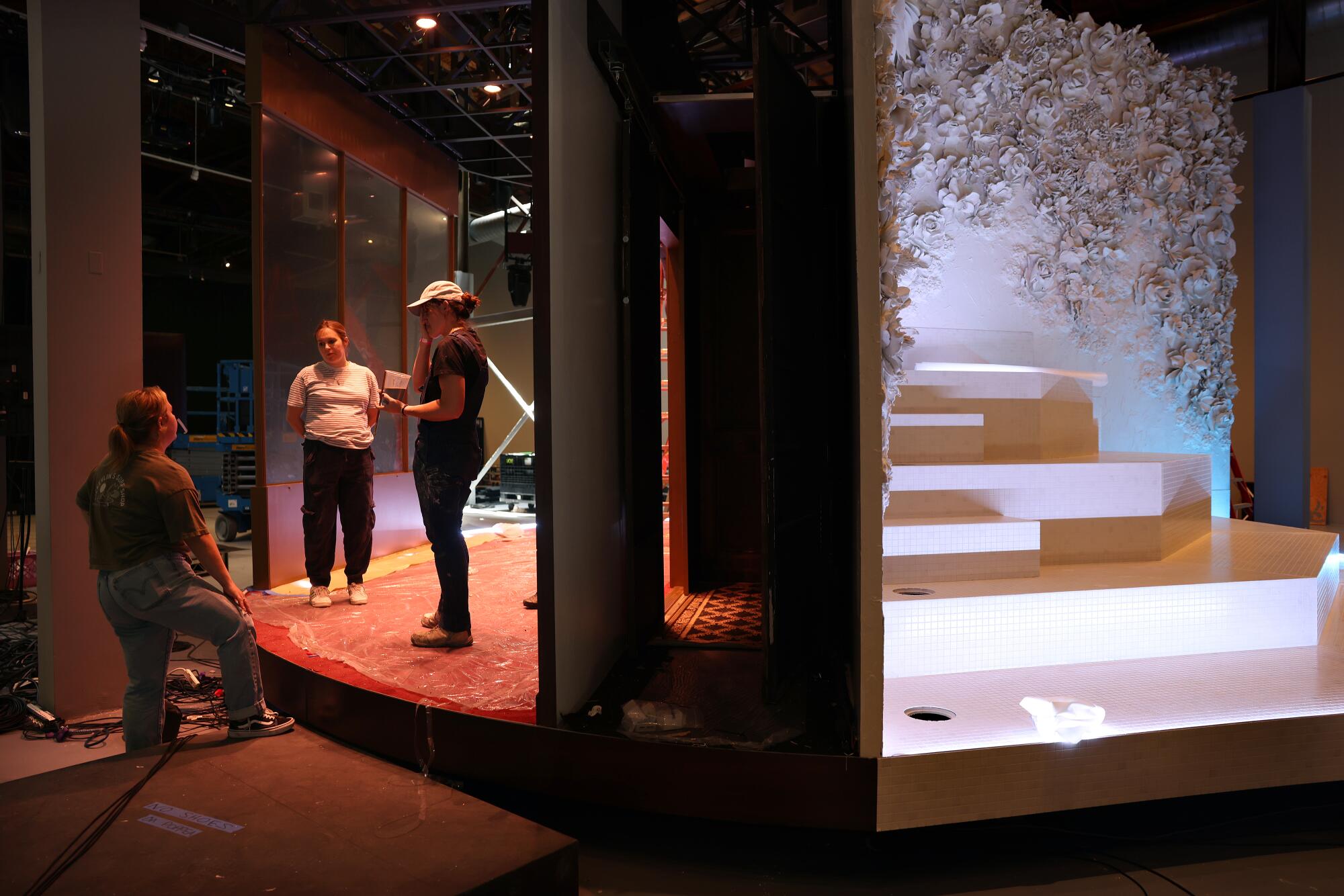 Crew members stand on "The Comet / Poppea's" double-sided rotating stage.