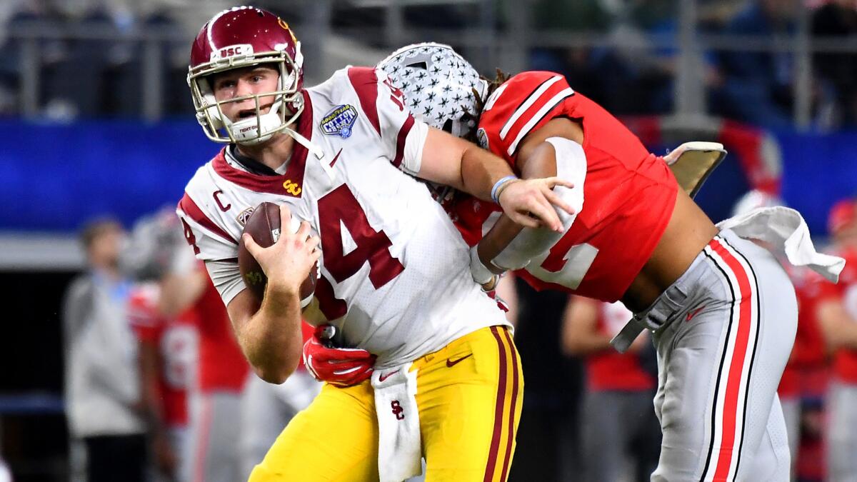 USC quarterback Sam Darnold is sacked by Ohio State defensive end Chase Young during the fourth quarter of the Cotton Bowl.