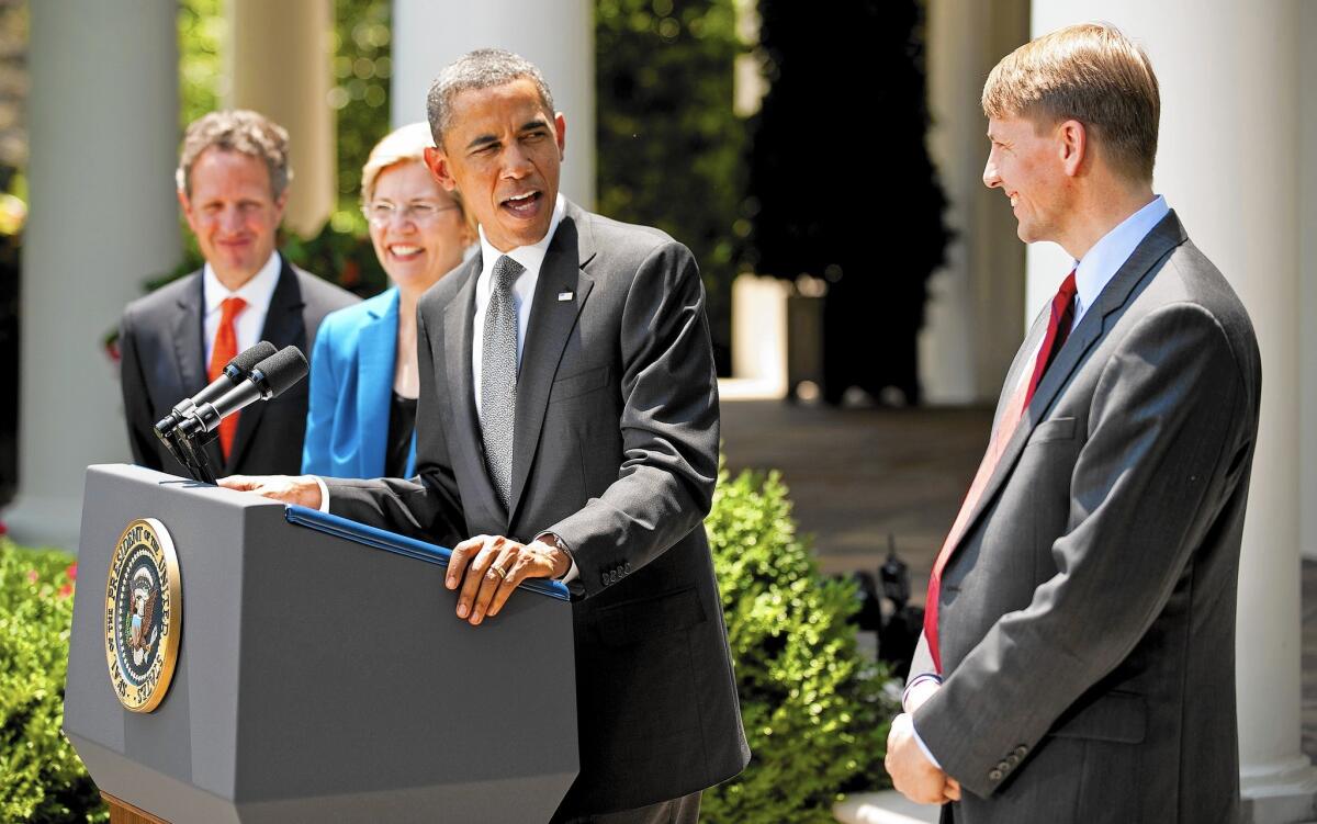 President Obama is shown with Richard Cordray, right, head of the Consumer Financial Protection Bureau. Under preliminary requirements unveiled by the bureau last year, payday lenders would have to determine upfront whether a borrower could repay the loan.