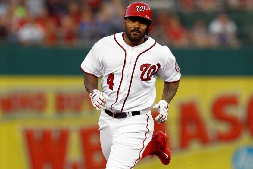 FILE - In this Aug. 15, 2017, file photo, Washington Nationals' Howie Kendrick rounds the bases after hitting a solo home run during the third inning of a baseball game against the Los Angeles Angels in Washington. The Nationals have agreed to a $7 million, two-year contract with Kendrick, a deal subject to a successful physical. Agent Pat Murphy confirmed the deal to The Associated Press on Monday, Jan. 15, 2018. (AP Photo/Carolyn Kaster, File)