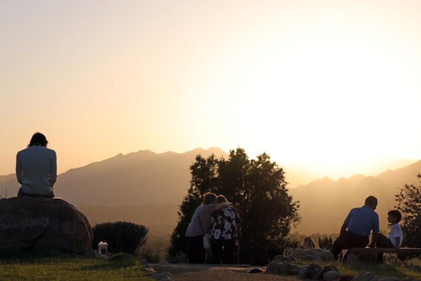 Ojai, CA - May 04: People relax on the grounds at Meditation Mountain at sunset at Ojai, CA. (Dania Maxwell / Los Angeles Times)
