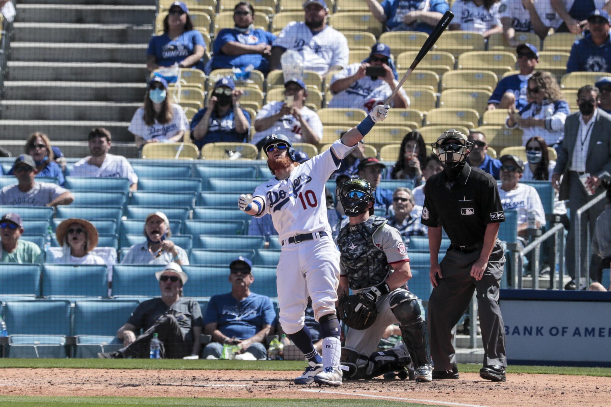 The Dodgers' Justin Turner connects for a solo homer in the sixth inning against the Nationals on Friday.