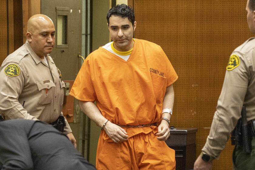LOS ANGELES, CA - MARCH 11, 2020 - Henry Solis, 32,, a former rookie LAPD officer who gunned down a man in Pomona and then fled to Mexico was sentenced Wednesday to 40 years in prison, today at criminal court, Los Angeles. Solis, 32, was convicted Feb. 5 of second-degree murder for the March 13, 2015, shooting of 23-year-old Salome Rodriguez Jr. The seven-man, five-woman jury also found that Solis had personally discharged a handgun during the commission of the crime. (Irfan Khan / Los Angeles Times)