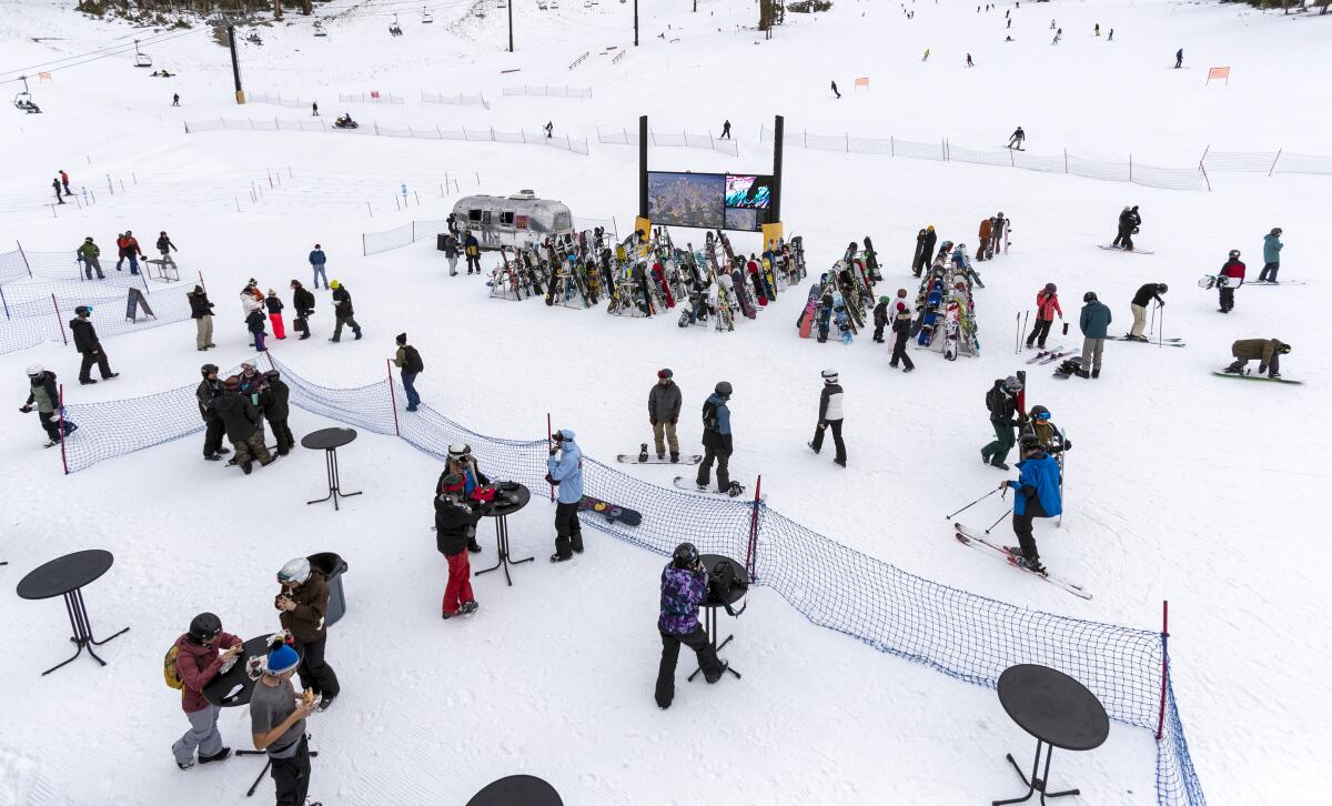 Tables have been moved outside for skiers and snowboarders to eat and social distance at Mammoth Mountain.
