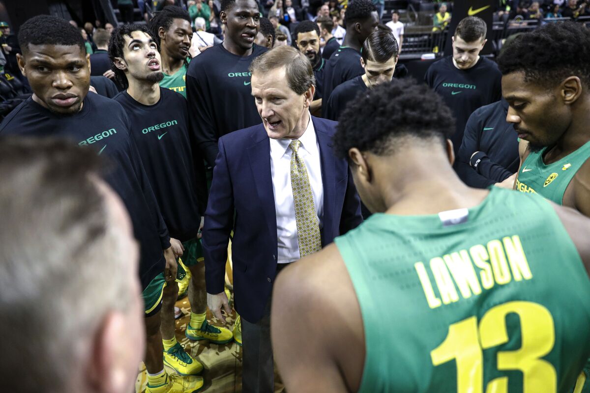 Oregon coach Dana Altman talks to the team before a game against Stanford.