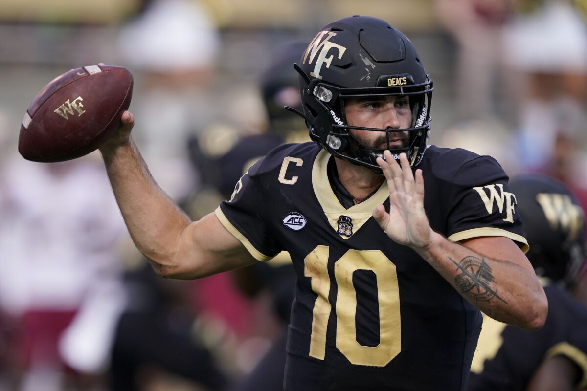 Wake Forest quarterback Sam Hartman passes against Florida State during the first half of an NCAA college football game Saturday, Sept. 18, 2021, in Winston-Salem, N.C. (AP Photo/Chris Carlson)