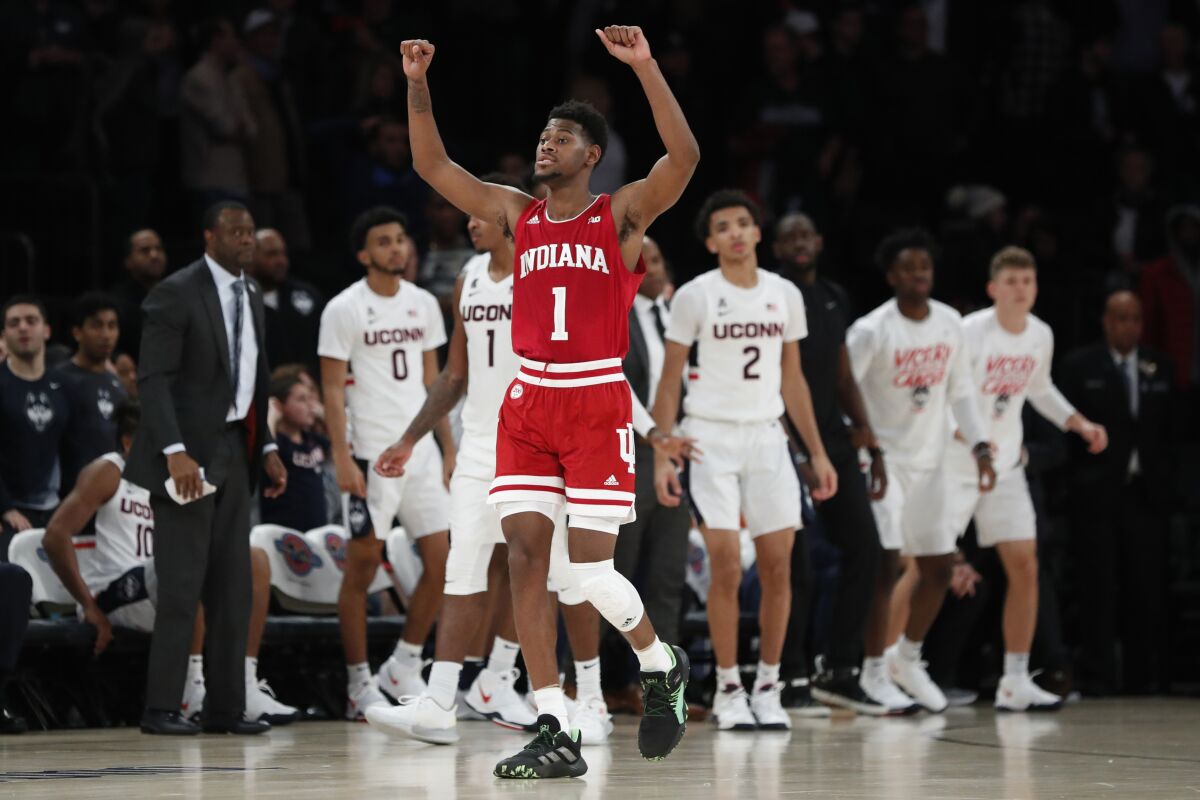 FILE - Indiana guard Al Durham (1) celebrates at the end of an NCAA college basketball game against Connecticut in the Jimmy V Classic in New York, in this Wednesday, Dec. 11, 2019, file photo. Durham was Indiana's most consistent 3-point shooter last season. (AP Photo/Kathy Willens, File)