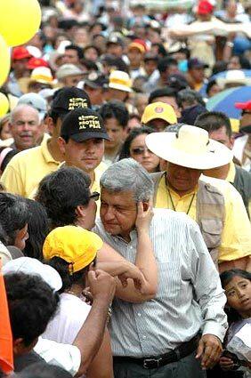 Leftist candidate Andres Manuel Lopez Obrador gets a kiss in Izamal, Mexico.