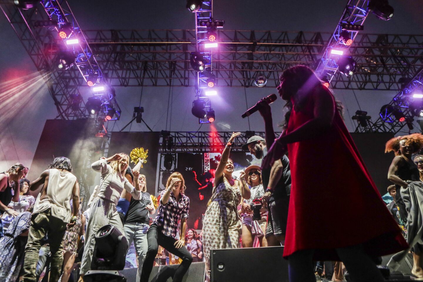 Santigold performs on the Franklin stage with many fans after inviting them to come up and dance with her.