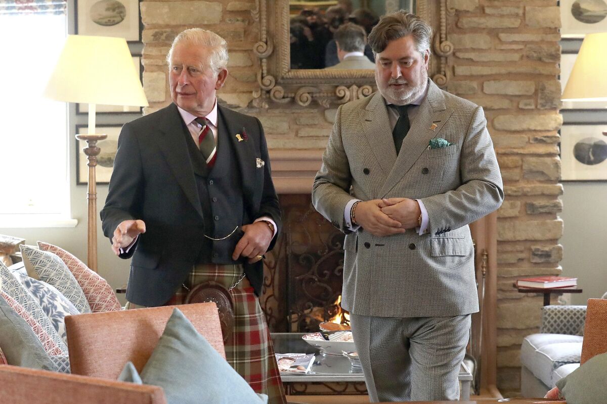 Britain's Prince Charles, left, and Michael Fawcett are shown in Caithness, Scotland, on May 5, 2019. A former top aide to Prince Charles has quit as chief executive of the royal’s charitable foundation after allegations he offered to help a wealthy Saudi businessman secure a knighthood and British citizenship after he gave a large donation. The Prince’s Foundation said late Thursday that Michael Fawcett had resigned. (Andrew Milligan/PA via AP)