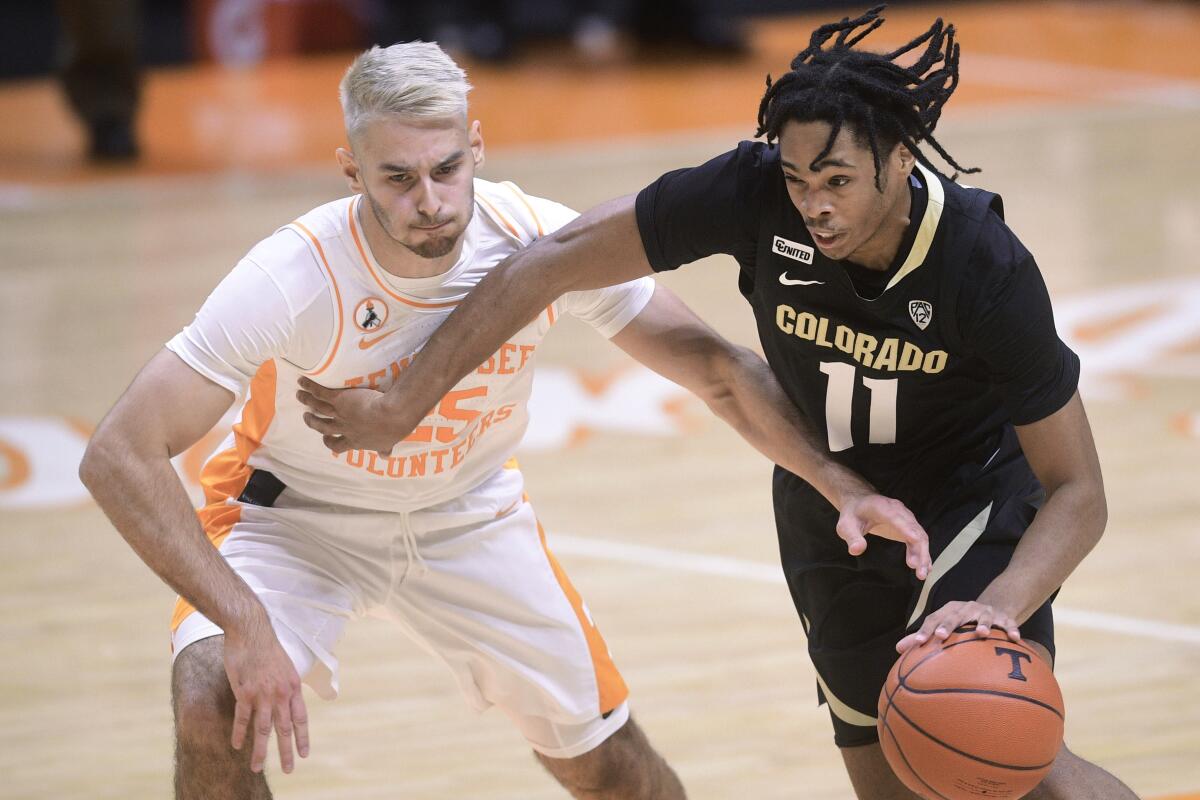 Tennessee's Santiago Vescovi defends against Colorado's Keeshawn Barthelemy.