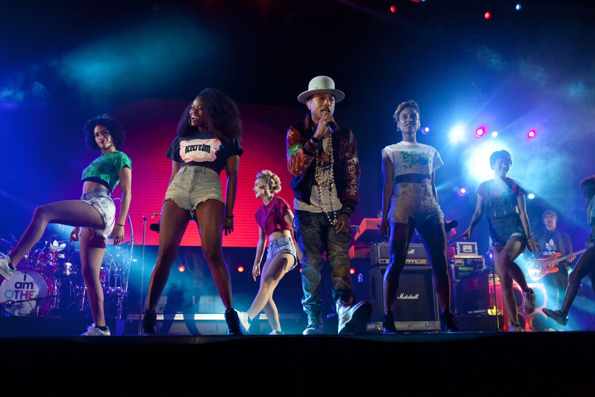 Pharrell Williams performs on the Camp Stage during Odd Future's third annual Camp Flog Gnaw carnival at the park outside of Los Angeles Memorial Coliseum on Saturday, Nov. 8, 2014.