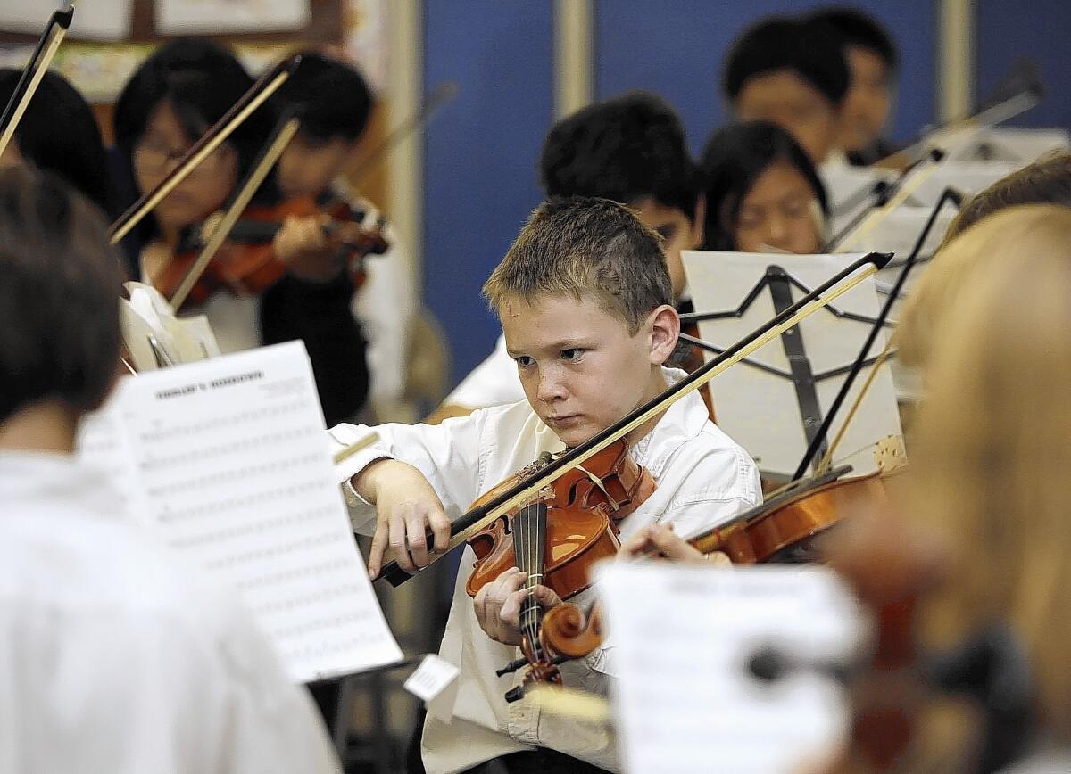 Tommy Stender, 10 and in 5th grade, plays the violin during the Valley View Elementary School Band and Orchestra Instrumental Spring Concert at the La Crescenta school on Thursday, May 13, 2010.