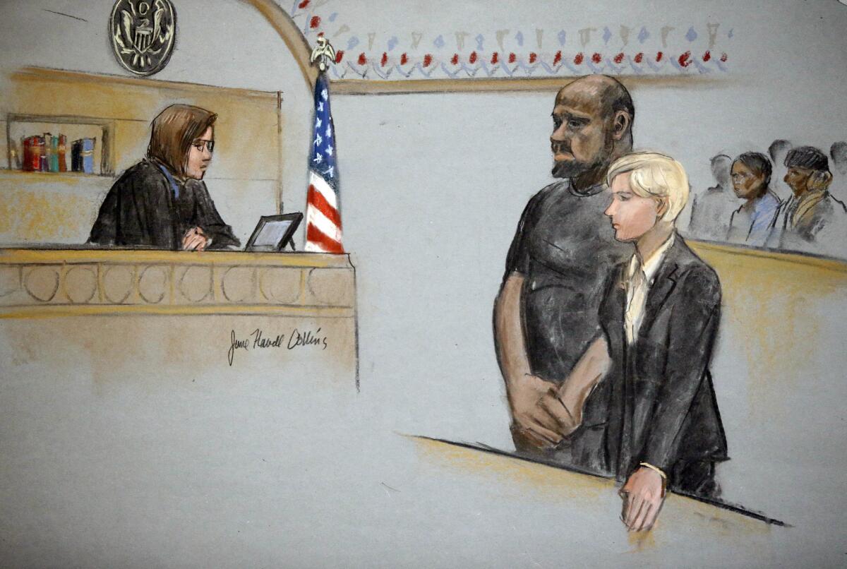 In this courtroom sketch, David Wright is depicted standing with his attorney Jessica Hedges as Magistrate Judge M. Page Kelley presides during a hearing Wednesday in federal court in Boston.