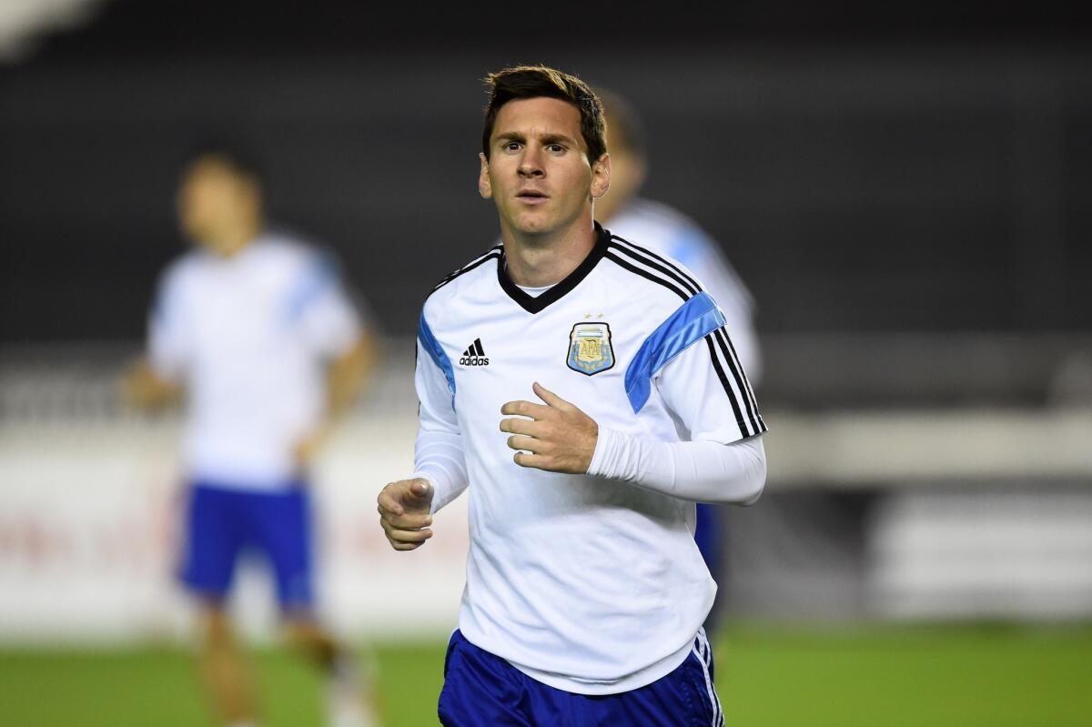 Argentina's Lionel Messi warms up during a training session Saturday in Rio de Janeiro, Brazil.