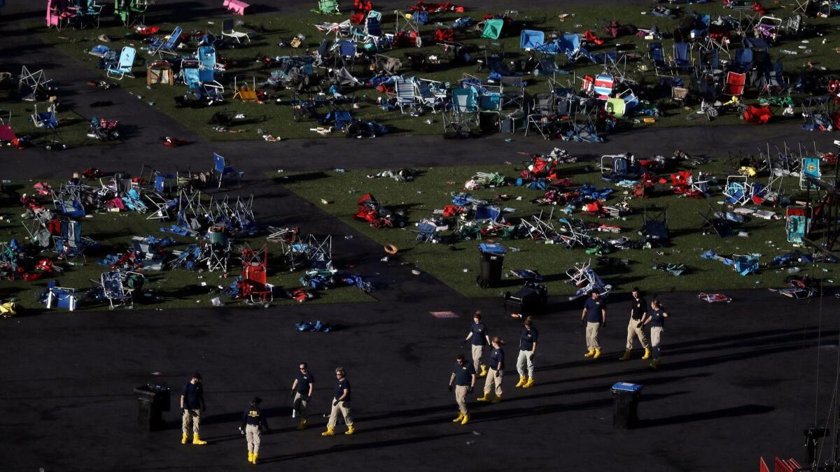 Investigators work at a festival grounds across the street from the Mandalay Bay Resort and Casino in Las Vegas on Oct. 3.