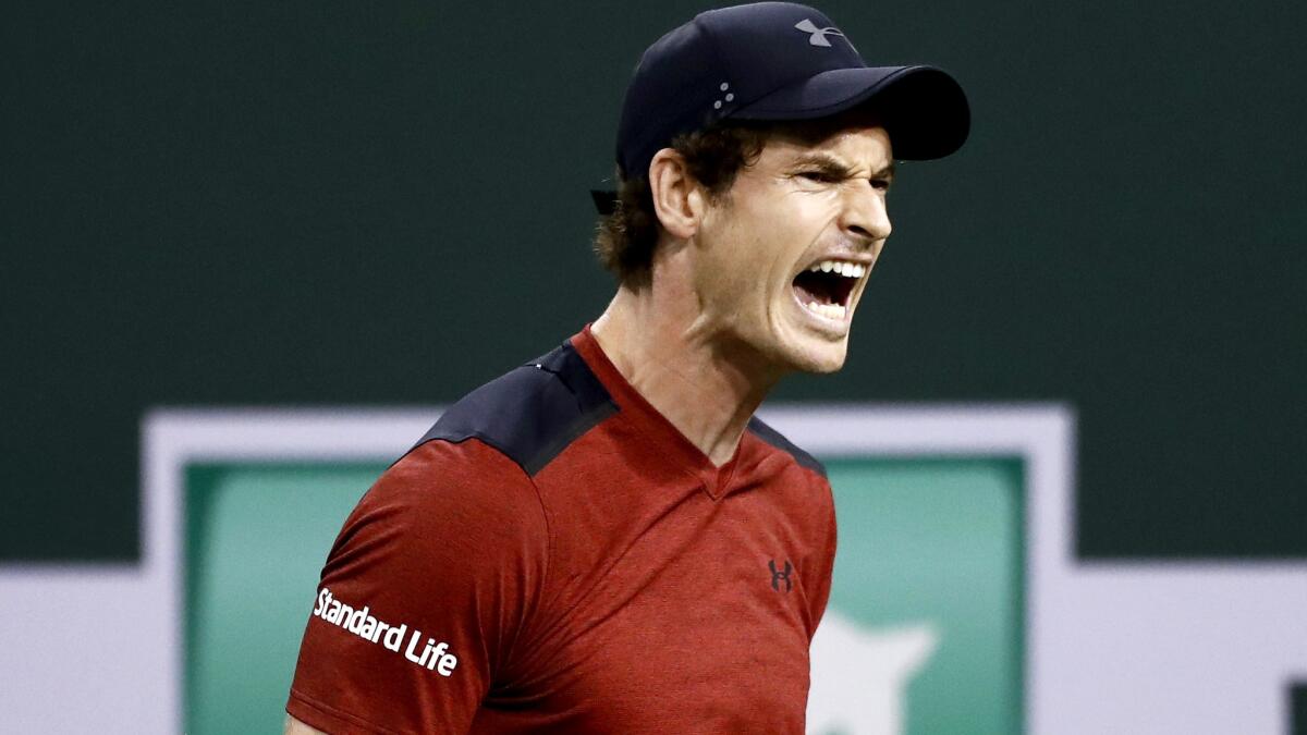Andy Murray reacts after a shot against Vasek Pospisil during their second-round match at the BNP Paribas Open on Saturday night.