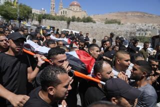 Mourners carry the bodies of Palestinians Wael Misha, 18, front, and Ahmed Sheikh Khalil, 20, both killed by an airstrike overnight during an army operation in the occupied West Bank, during their funeral in the refugee Camp of Balata, in Nablus, Thursday, Aug. 15, 2024. (AP Photo/Nasser Nasser)