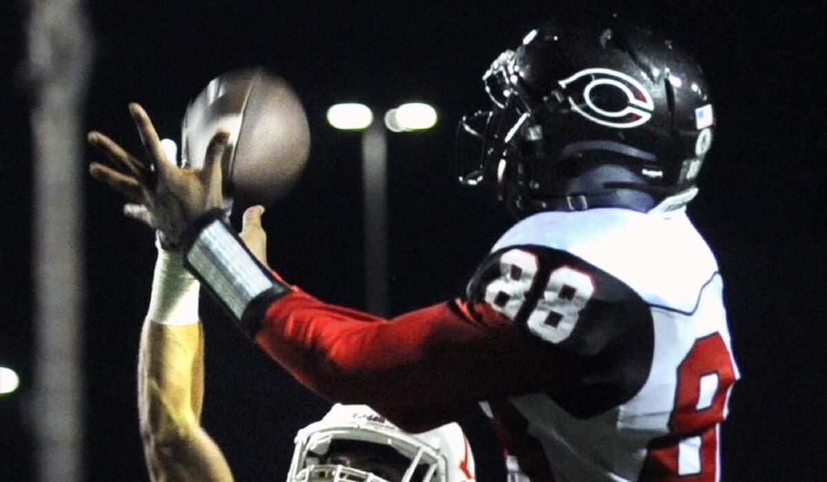 Corona Centennial receiver Javon McKinley can't come up with the catch but Orange Lutheran's Lance Dravis is called for pass interference in the third quarter.
