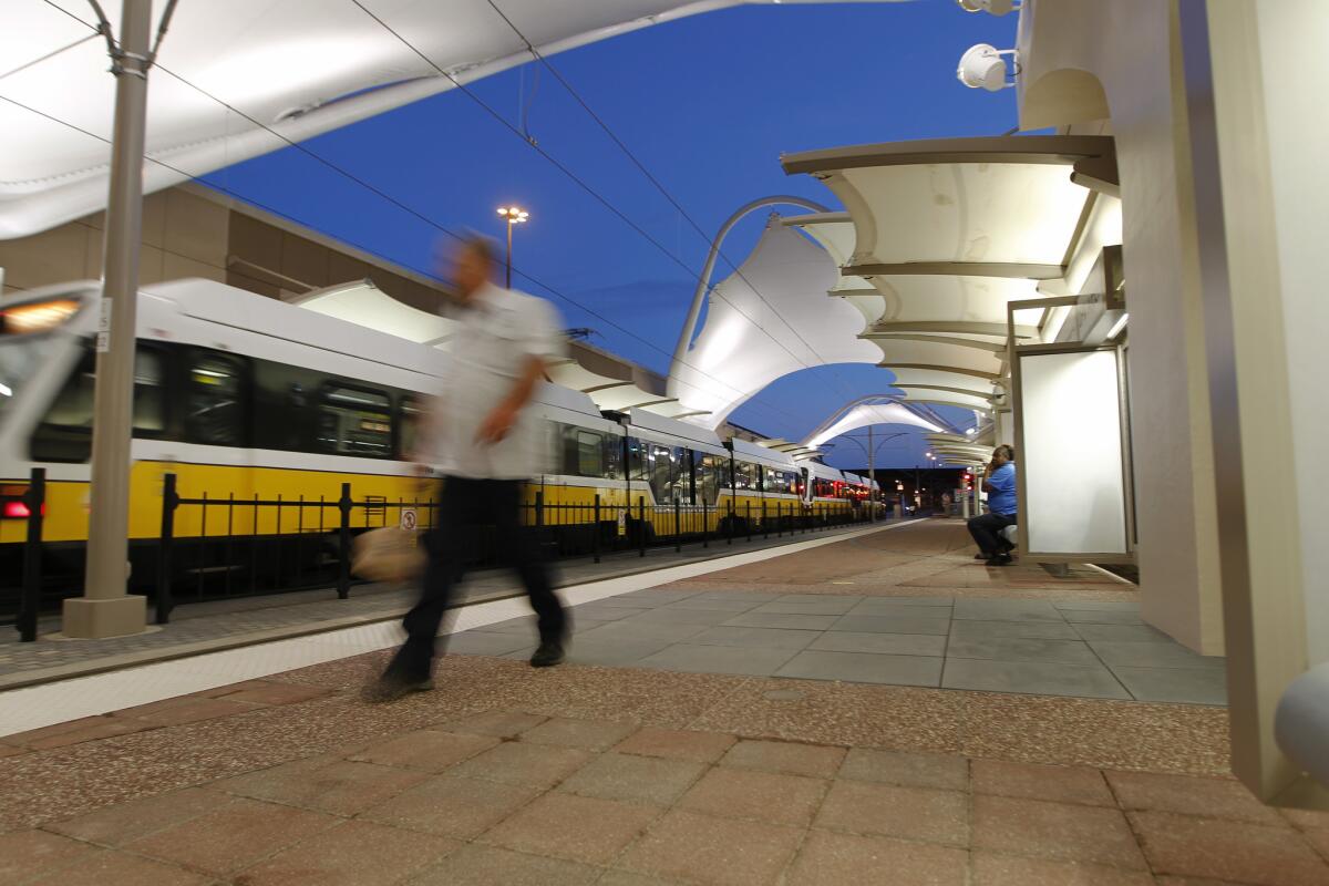 A train arrives at the station at Terminal C at the Dallas/Fort Worth International Airport on Monday, the first day of light-rail service connecting downtown Dallas and DFW.