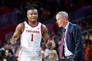 Los Angeles, California November 9, 2023-USC's Isaiah Collier and head coach Andy Enfield.