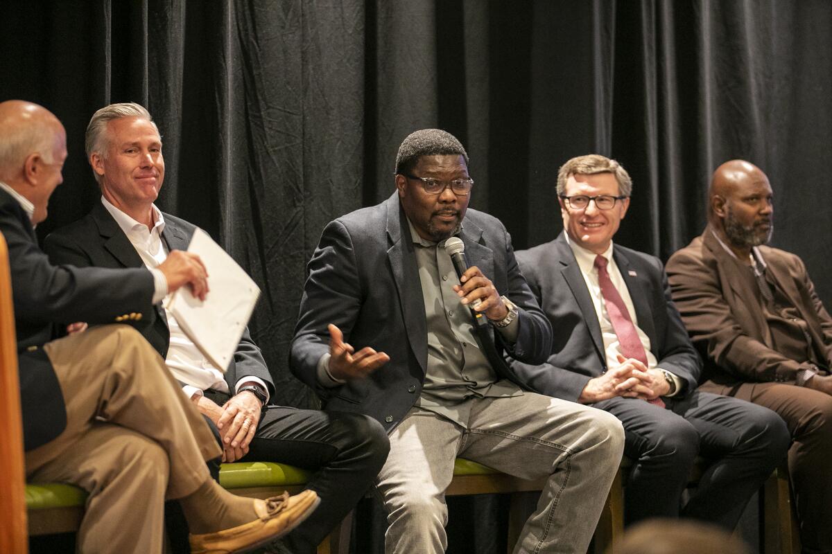 James Washington, center, speaks during the KidWorks annual Foundation for Success luncheon on Thursday.  