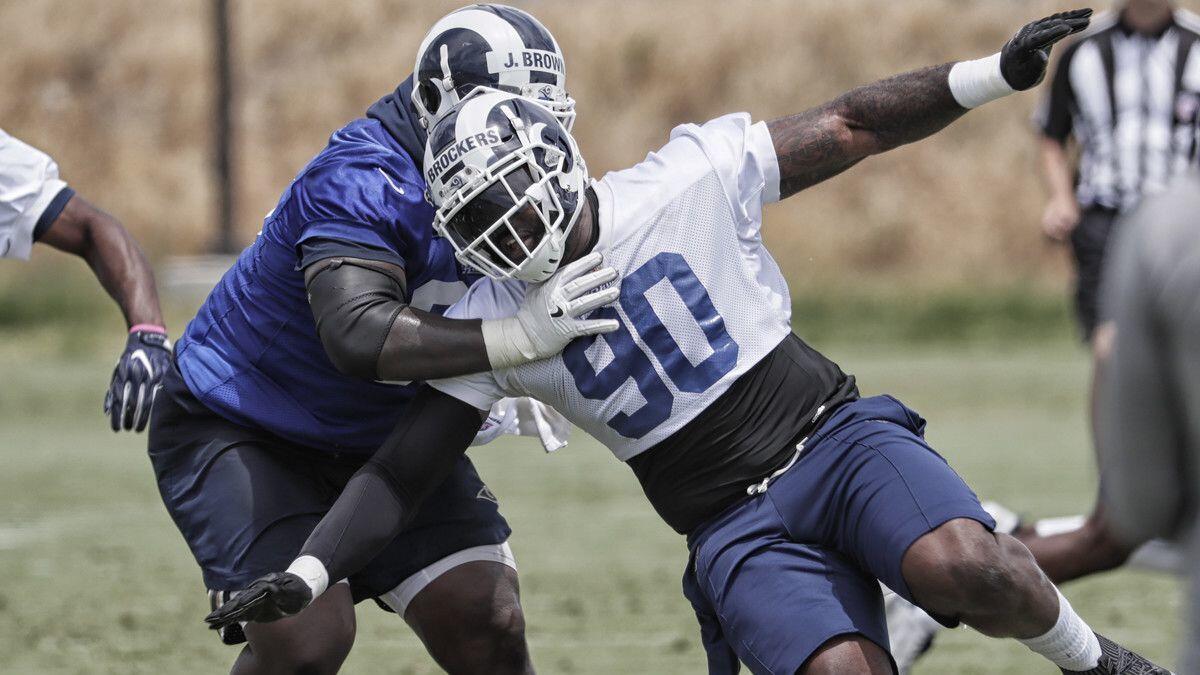 Rams defensive lineman Michael Brockers rushes past guard Jamon Brown during in intersquad scrimmage in June at Cal Lutheran.