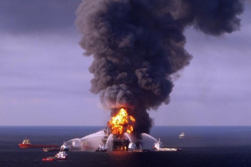 A U.S. Coast Guard handout image of fire boat response crews as they battle the blazing remnants of the BP-operated offshore oil rig, Deepwater Horizon, in the Gulf of Mexico. BP will pay a record criminal penalty to resolve some of its liability for the 2010 Deepwater Horizon disaster that killed 11 workers.
