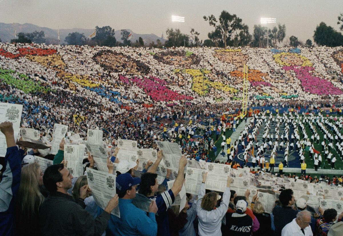 The Super Bowl XXVII halftime show featured more than 10,000 people raising colored cards to create a mosaic of children