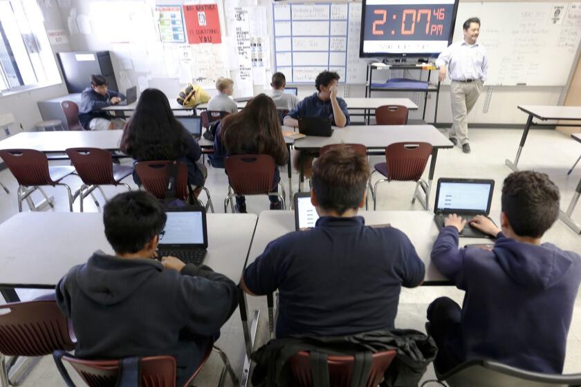 LOS ANGELES, CA - MAY 17, 2017 -- Students in the classroom of 8th grade teacher Ron Ortiz at Magnolia Science Academy number 4 on Wednesday May 17, 2017 as parents talk about the conflict between charters and traditional public schools that was the crux of yesterday's election, The debate also reaches the campus level at places like Daniel Webster Middle School, where Magnolia Charter and Daniel Webster Middle School co-exist. (Al Seib / Los Angeles Times)