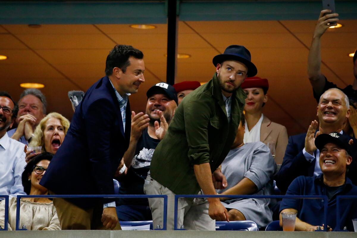"Tonight Show" host Jimmy Fallon and singer-actor Justin Timberlake dance to "Single Ladies" during the men's singles quarterfinals match on Wednesday, Sept. 9, 2015, in New York.