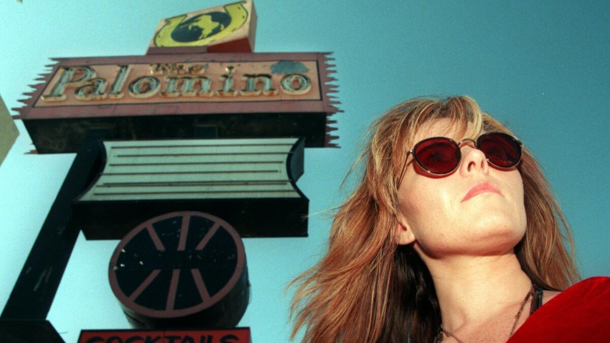 Astrid Young, Neil Young's sister, was photographed in 1995 in front of the marquee at the Palomino Club in North Hollywood, which closed that year.