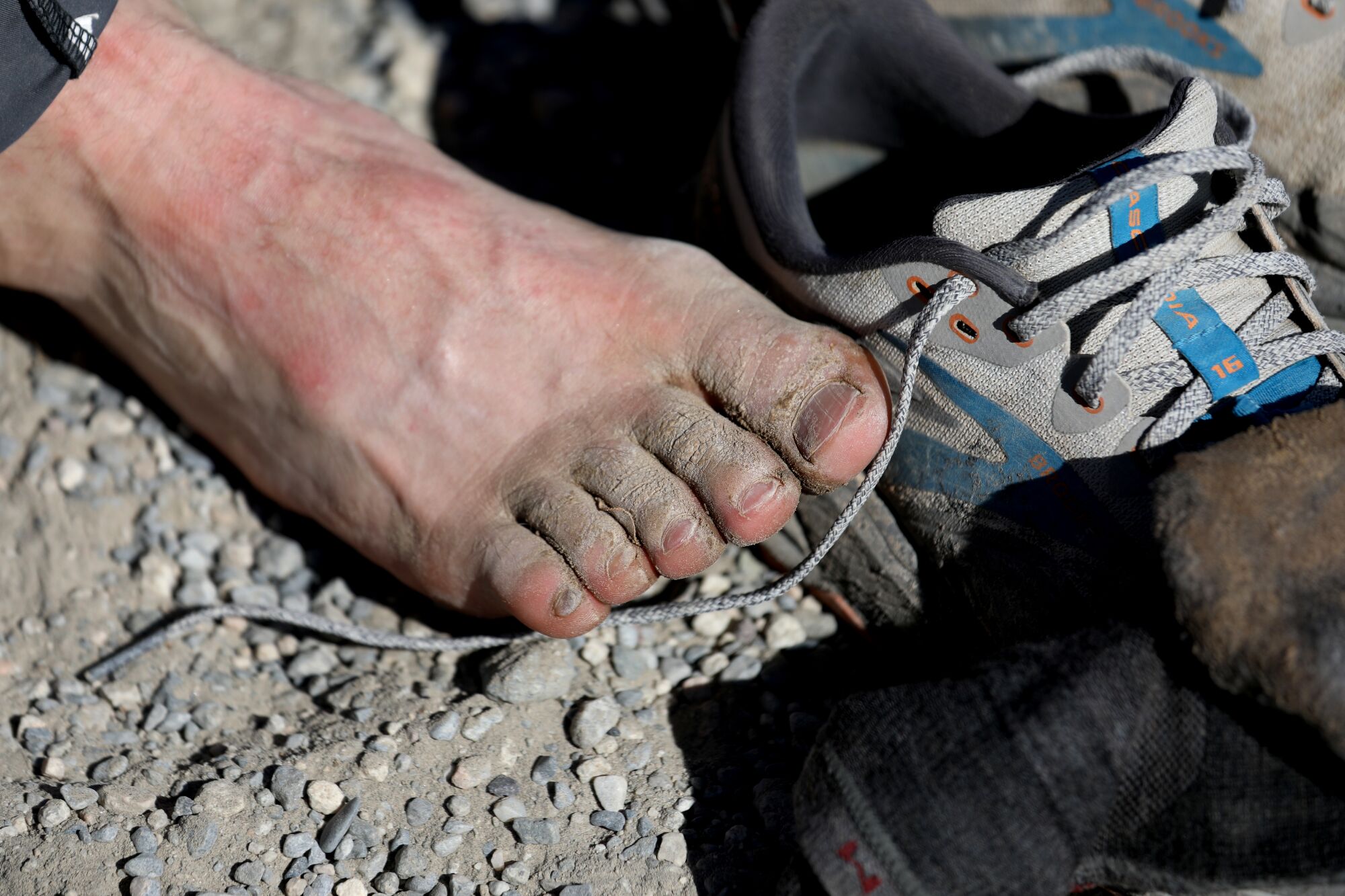 Cameron Hummels' feet covered with caked-on dirt in Death Valley.  