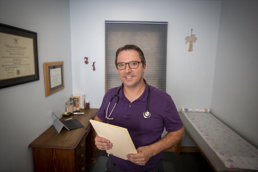 CAPISTRANO BEACH, CALIF. -- THURSDAY, AUGUST 29, 2019: Pediatrician Dr. Bob Sears, author of The Vaccine Book and The Autism Book, and co-author of The Baby Book, at his Sears Family Pediatrics in Capistrano Beach Thursday, Aug. 29, 2019. Sears is well-known for his alternative vaccination schedule for children and is a main opponent of a bill to tighten restrictions in California on who qualifies for medical exemptions. (Allen J. Schaben / Los Angeles Times)