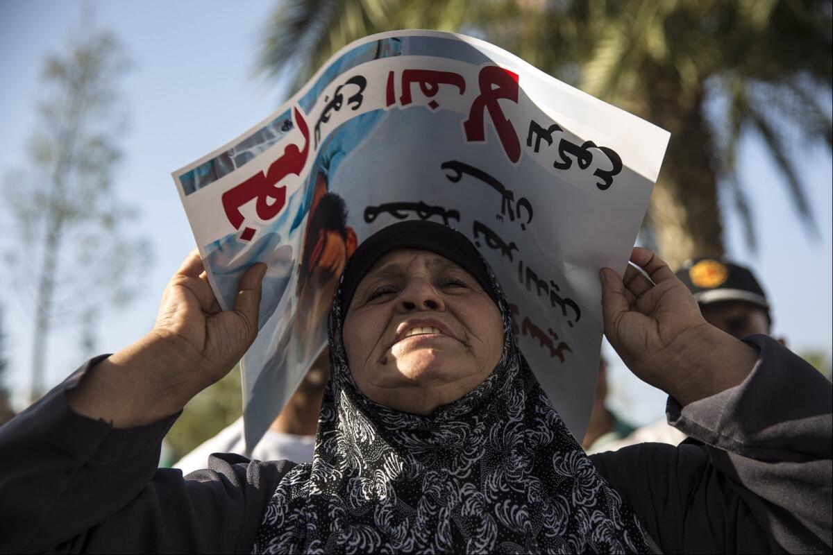 Mazoza Allan, the mother of Palestinian hunger striker Mohammed Allan, takes part in a rally outside Soroka hospital in the southern Israeli city of Beersheba on Aug. 9.