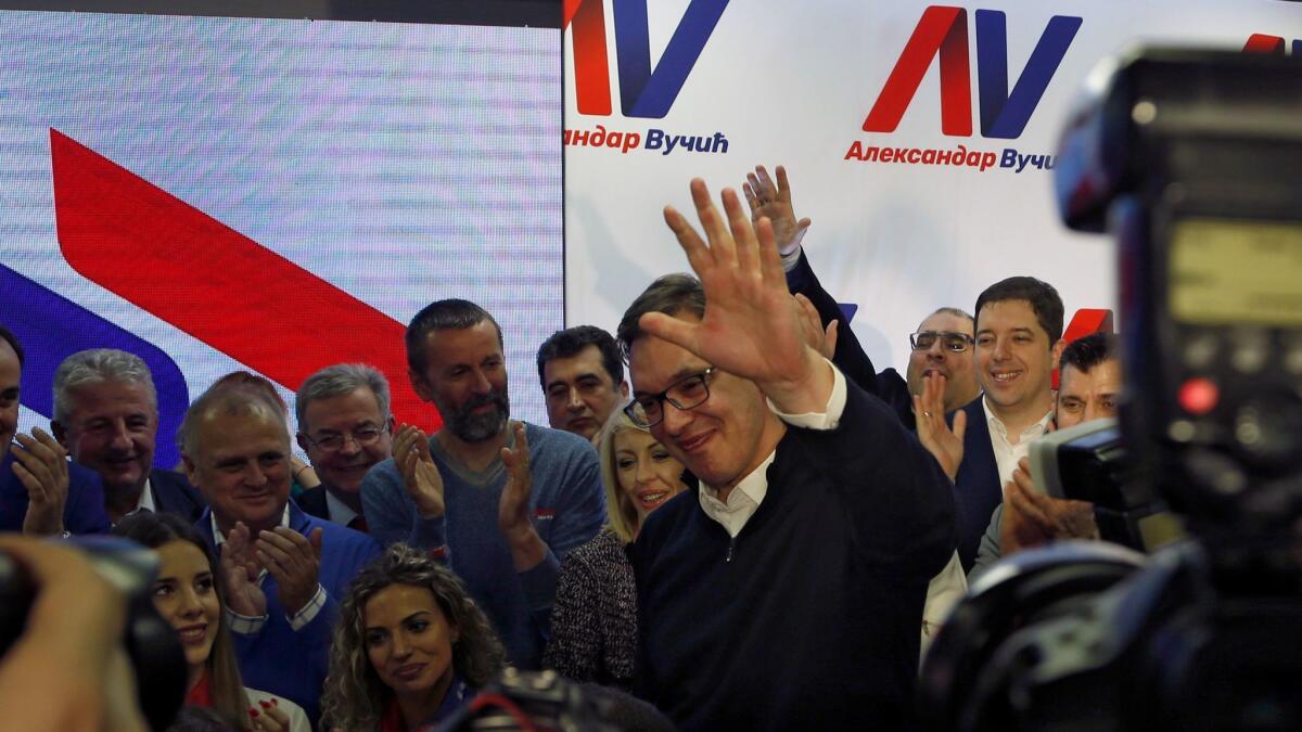 Serbian Prime Minister Aleksandar Vucic, center, celebrates in Belgrade after claiming victory in the presidential election on April 2, 2017.