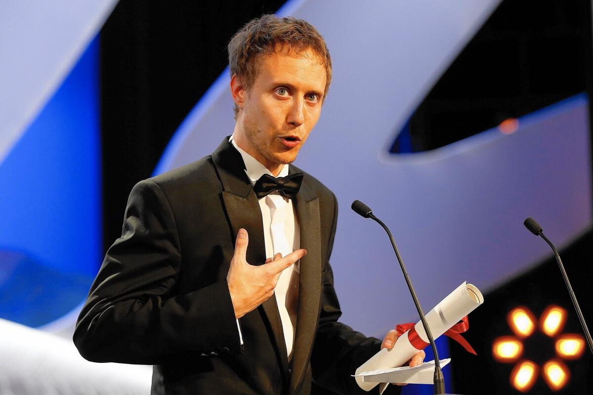 Hungarian director Laszlo Nemes accepts the Grand Jury Prize during the closing ceremony of the 68th Cannes Film Festival in Cannes, southeastern France.