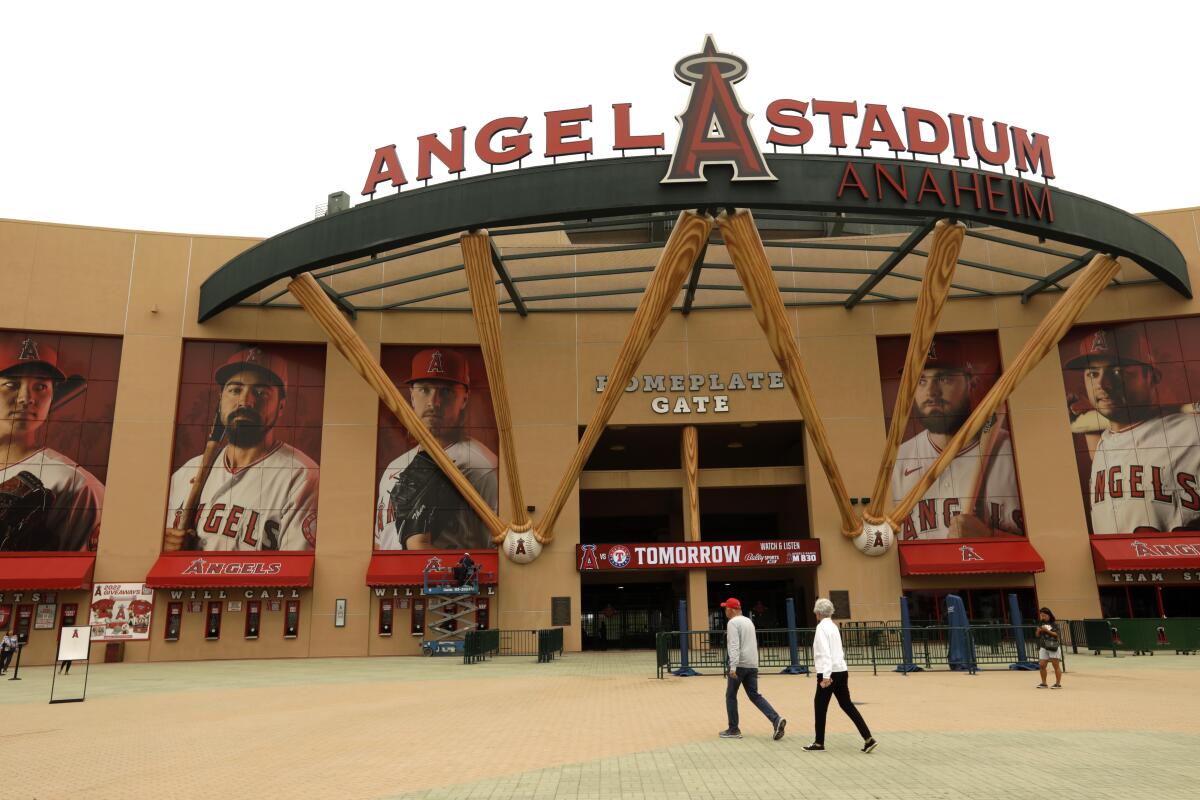 Fans go to buy tickets near the main entrance to Angel Stadium on May 23.