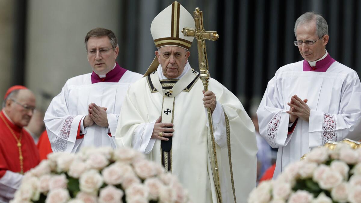 Pope Francis celebrates Easter Mass in St. Peter's Square at the Vatican.