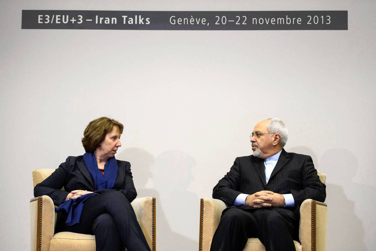 European Union foreign policy chief Catherine Ashton talks with Iranian Foreign Minister Mohammad Javad Zarif in Geneva, where six world powers and Iran began a new round of talks on curbing Tehran's nuclear program.