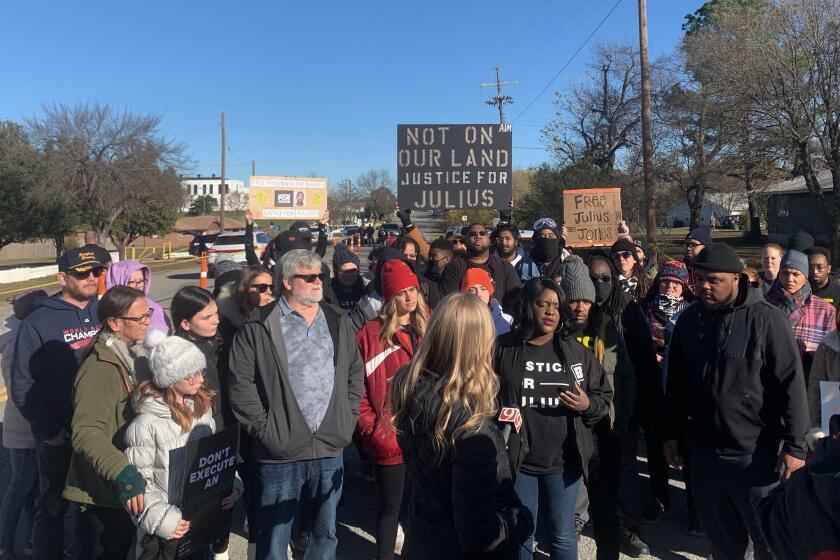 Supporters of Julius Jones rally outside Oklahoma State Penitentiary on Thursday, Nov. 18, 2021 in Norman, Okla. Jones is scheduled to receive the lethal injection in Oklahoma's highest-profile execution in decades. Jones was convicted of murder in the 1999 killing of Paul Howell, a suburban Oklahoma City businessman. The 41-year-old Jones maintains he was framed by the actual killer, a co-defendant who testified against him and was released from prison after 15 years. (Reese Gorman/The Norman Transcript via AP)