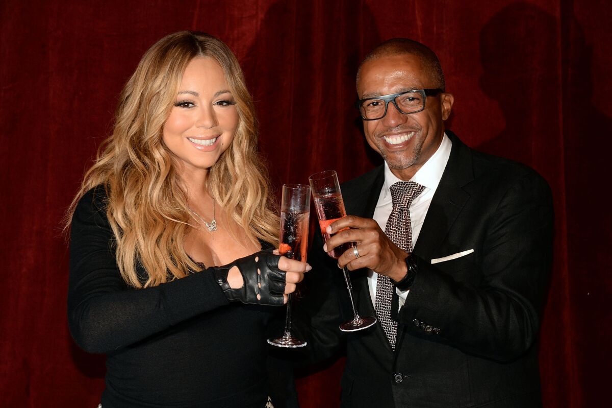 Singer Mariah Carey and business partner Kevin Liles, CEO of Go N'Syde beverages, announce the launch of her new beverage Butterfly in New York on Monday.